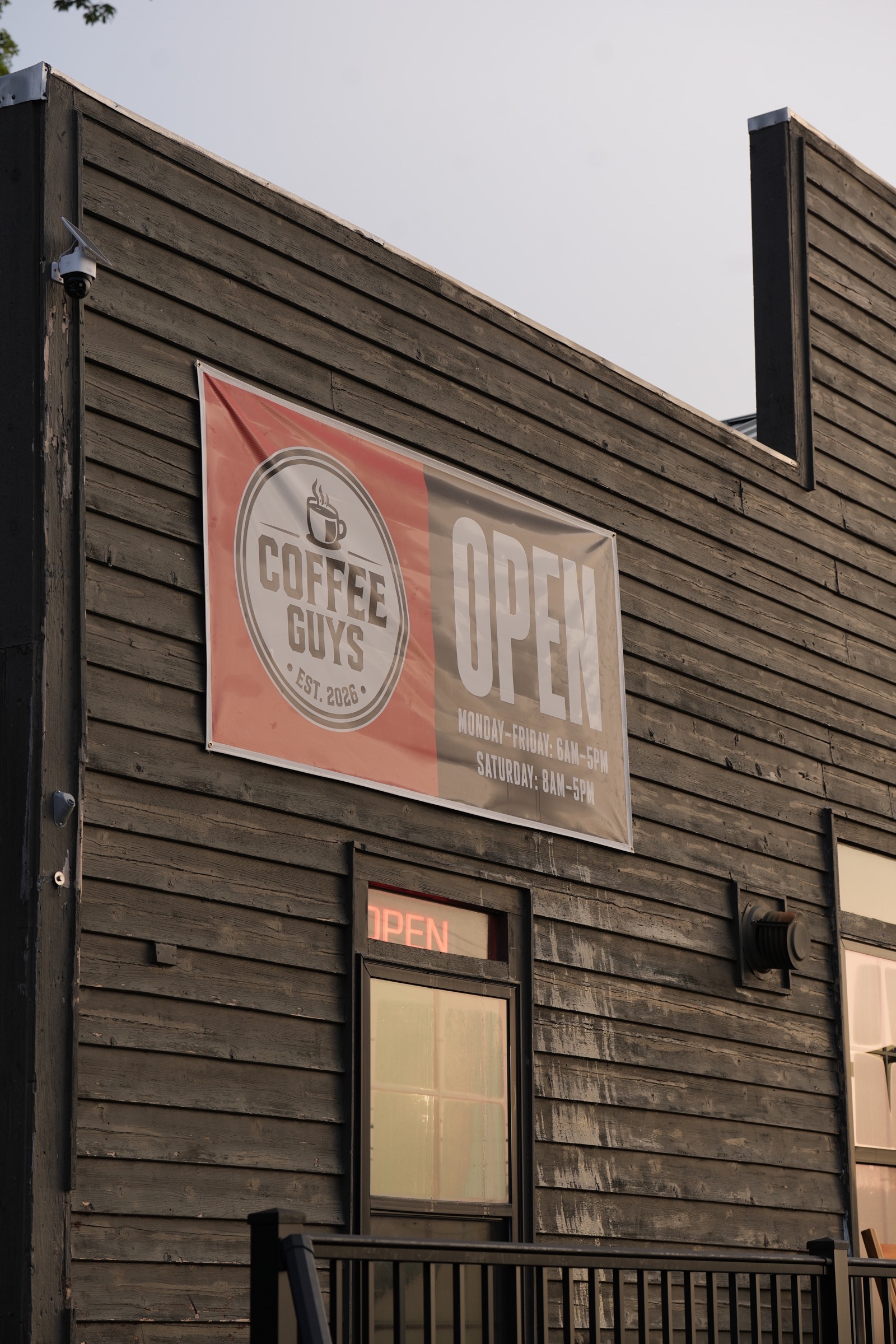 Coffee Guys shop exterior with the open sign